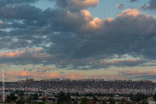 View of the cloudy sky over the city © Tishina