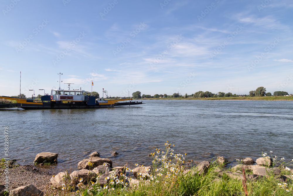Ferry service between the village of Olst in Overijssel and Welsum in Gelderland over the river IJssel. Ferry service between the village of Olst in Overijssel and Welsum in Gelderland over the river IJssel.