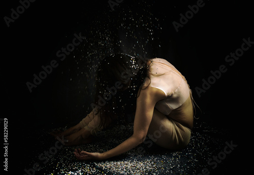woman in the privacy of the home under a dim light III