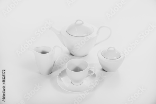 tea cup and teapot on white background