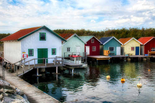 Afternoon with Fisherman’s Cabins at the Beautiful Breviks Fishing Harbor on the Southern Koster Island, Sweden photo