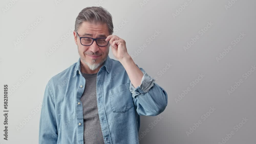 Portrait of mature age, middle age, mid adult casual man in 50s, happy confident smile. White background, copy space. Portrait of mature age, middle age, mid adult casual man in 50s, happy confident smile. White background, copy space.