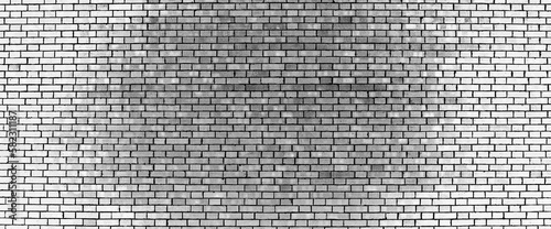 Grayscale backdrop with old realistic white brick wall. Minimal fragment of brickwall close-up. Minimalist monochrome background with wall of gray bricks in different shades. Simple wall texture.