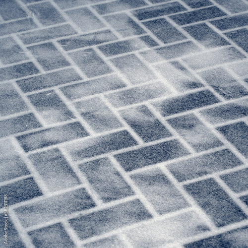 Unusual design of floor made of icy bricks. Minimal background with Simple texture of brick wall of transparent ice. Perspective of floor in cold winter palace. Minimalist backdrop of icy wall.
