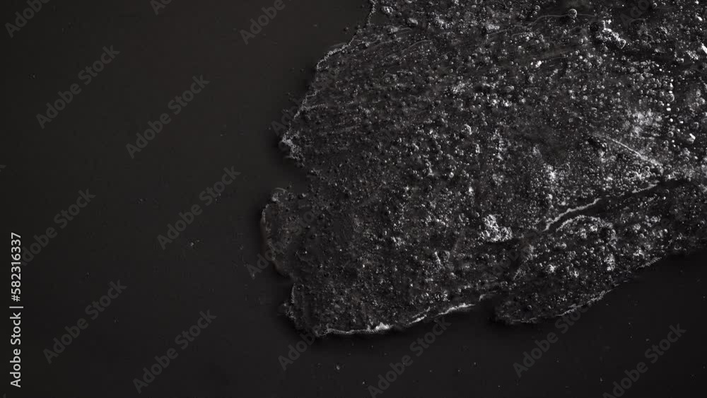 Ice Melts On A Black Surface
