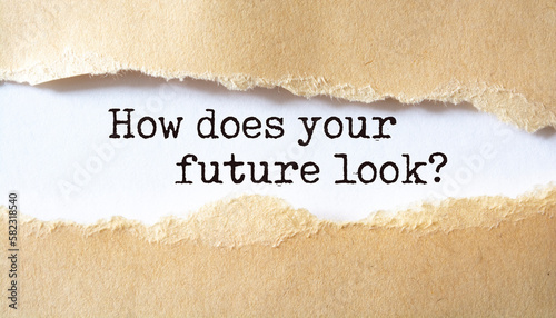 How does your future look?. Words written under torn paper. Motivation concept text.