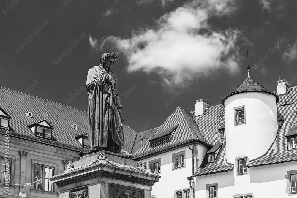 Stuttgart, Germany - June 2018: Bronze statue of Friedrich Schiller in the Castle Square; Johann Christoph Friedrich von Schiller 1788–1805, German playwright, poet, and philosopher in black and white