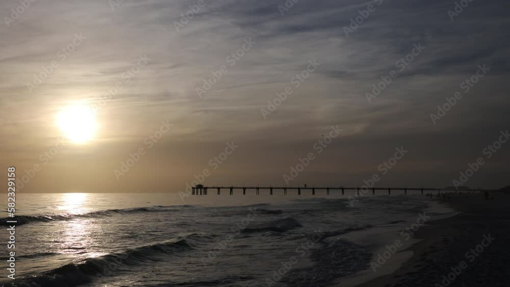 Susnet on a hazy cloudy evening at the Okaloosa Island Pier in Ft. Walton Beach, Florida Susnet on a hazy cloudy evening at the Okaloosa Island Pier in Ft. Walton Beach, Florida