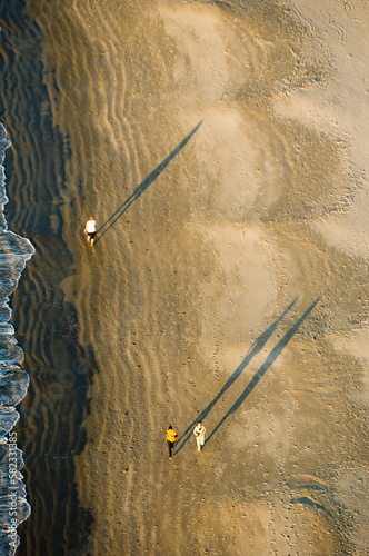 overhead view of people doing sports on the beach