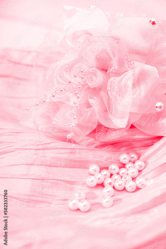 Close up of pink rose wedding dress lace and fabric