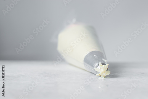 Buttercream in a piping bag, American buttercream in a piping bag for icing cake, frosting for decorating cake photo