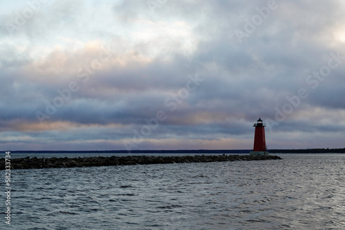 lighthouse and cloudy skies © Michael