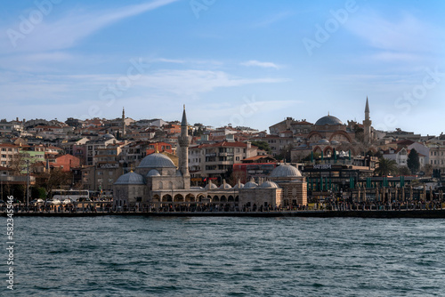 Uskyudar district in the Asian part of Istanbul and the Shemsi Ahmed Pasha Mosque from the Bosporus water area on a sunny day, Istanbul, Turkey