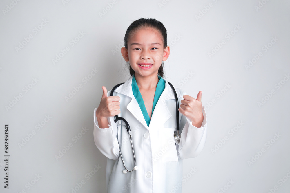 Asian child Wearing a doctor's suit and having a stethoscope