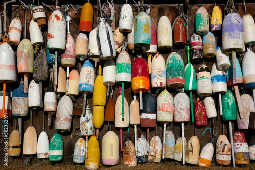 Buoys on wall in Maine.