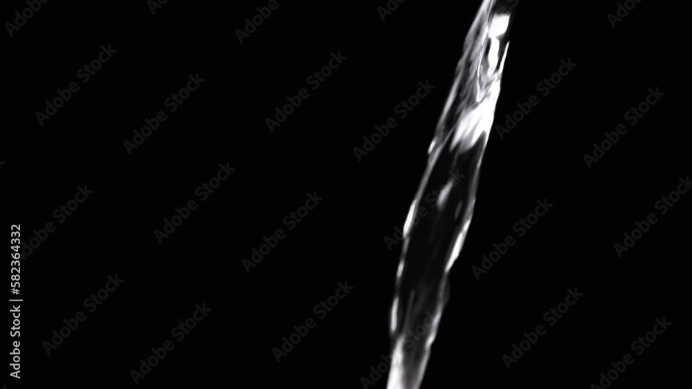 Transparent Jet of Clean Water Pouring on an Isolated Black Background. One thin stream glitters in the light. Slow motion of falling water. Water drops. Drink clean water. Preparation of tea, coffee. Transparent Jet of Clean Water Pouring on an Isolated Black Background. One thin stream glitters in the light. Slow motion of falling water. Water drops. Drink clean water. Preparation of tea, coffee.