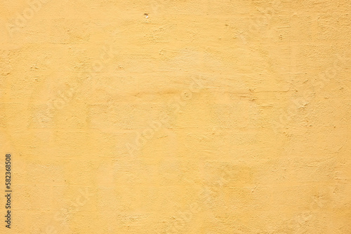 Old yellow concrete block wall background and texture for background.