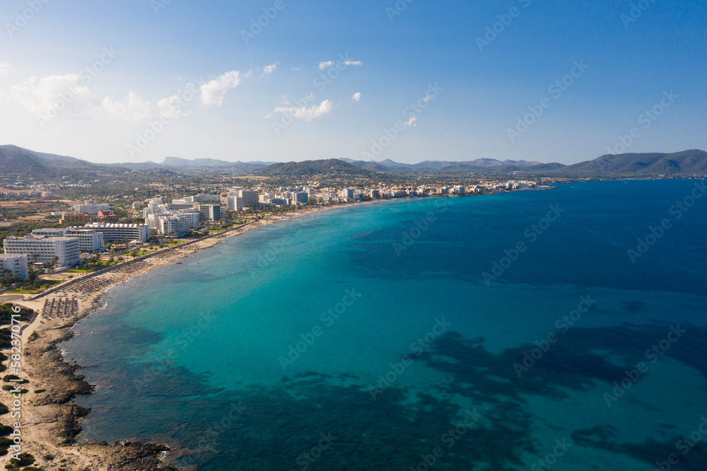 An aerial panoramic view on Cala Millor beach on Mallorca island in Spain at evening time