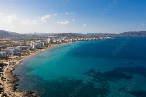 An aerial panoramic view on Cala Millor beach on Mallorca island in Spain at evening time