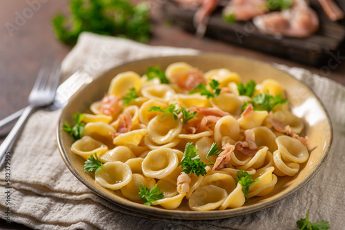 Homemade pasta with ham and garlic