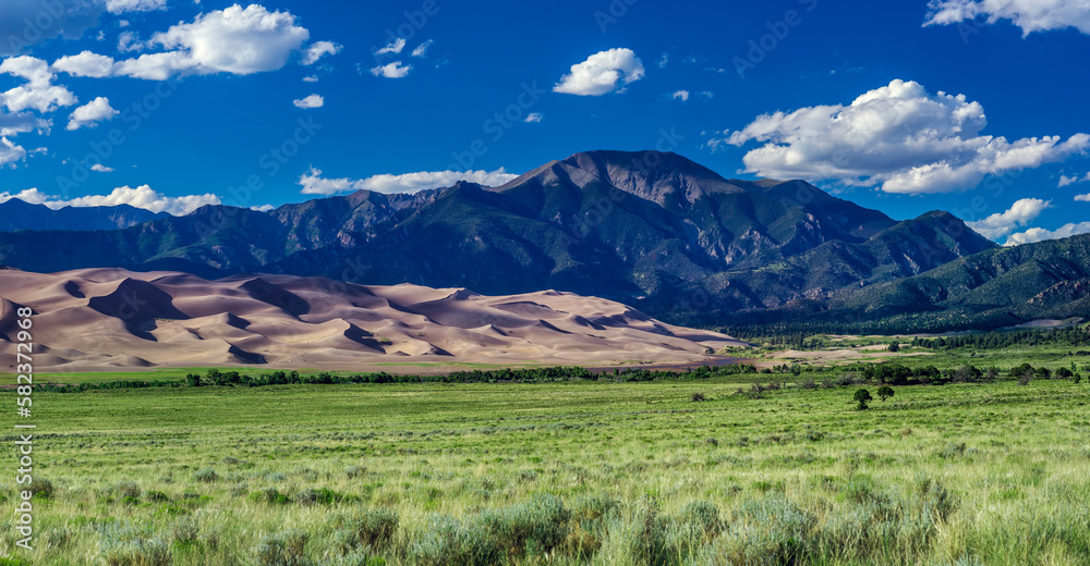 Scenic view of landscape against sky on sunny day Scenic view of landscape against sky on sunny day