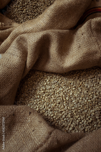 High angle view of raw coffee beans in sack