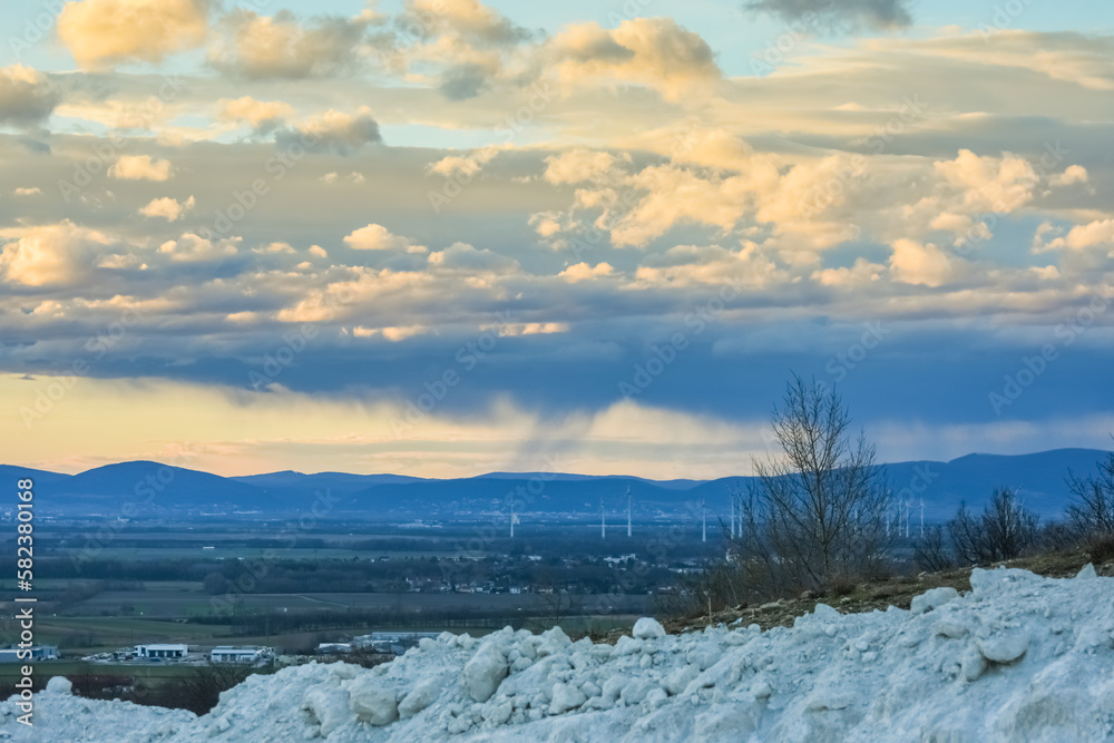 clouds and rain in a landscape with a lime quarry clouds and rain in a landscape with a lime quarry