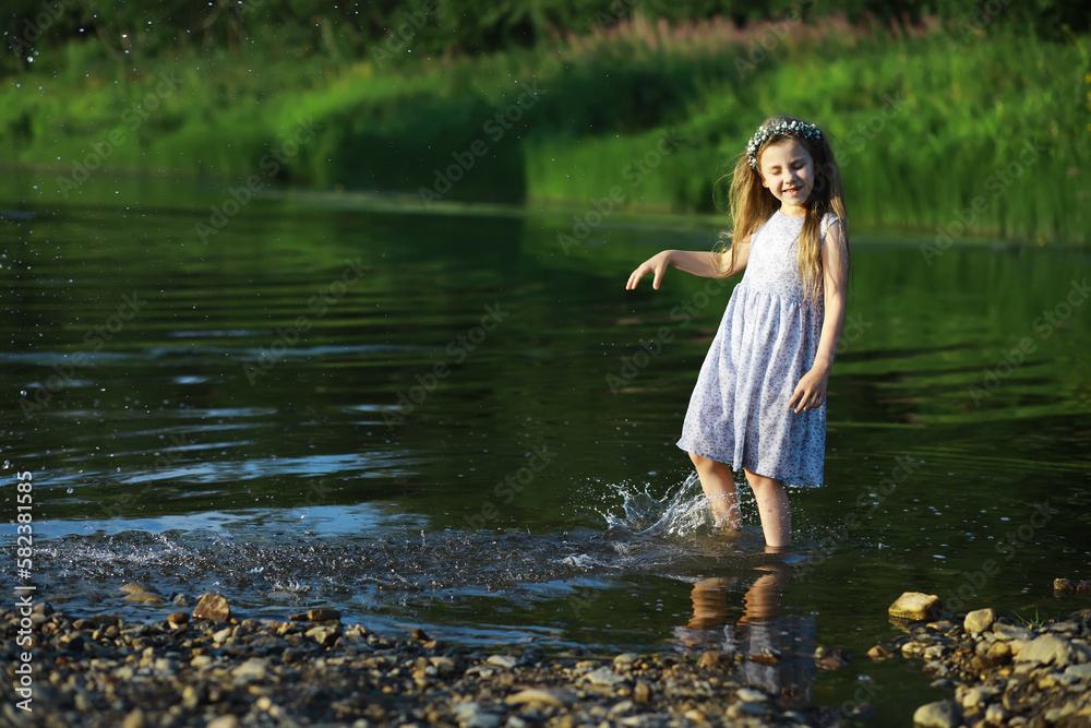 Children walk in the summer in nature. Child on a sunny spring morning in the park. Traveling with children. Children walk in the summer in nature. Child on a sunny spring morning in the park. Traveling with children.