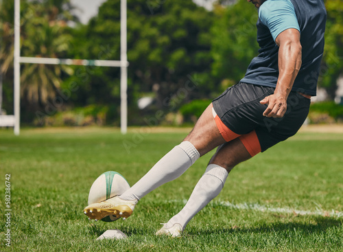 Rugby, sports man or kickball in game, practice workout or training match on stadium field outdoors. Fitness body, score goals or athlete player action playing in cardio exercise on grass in France photo