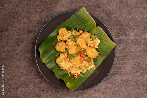 Gejrot tofu is a typical food from Cirebon, West Java, Indonesia which is made from tofu and other spices. usually served in small containers photo