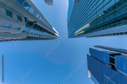 Tablou canvas Austin, Texas- Skyscrapers view from below with reflective glass exterior against the blue sky