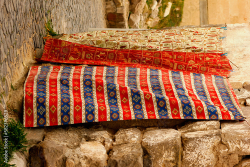 Colorful embroidered cloths sold in the market photo