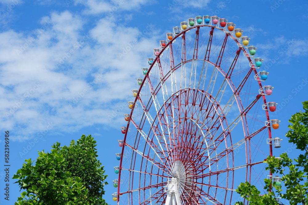 A ferris wheel on blue sky