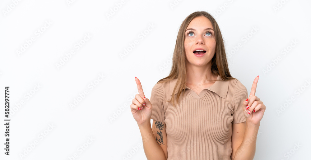 Young Lithuanian woman isolated on white background surprised and pointing up Young Lithuanian woman isolated on white background surprised and pointing up