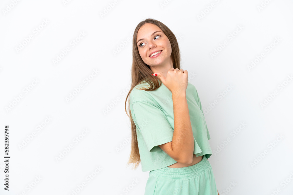 Young Lithuanian woman isolated on white background pointing to the side to present a product Young Lithuanian woman isolated on white background pointing to the side to present a product