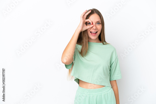 Young Lithuanian woman isolated on white background showing ok sign with fingers