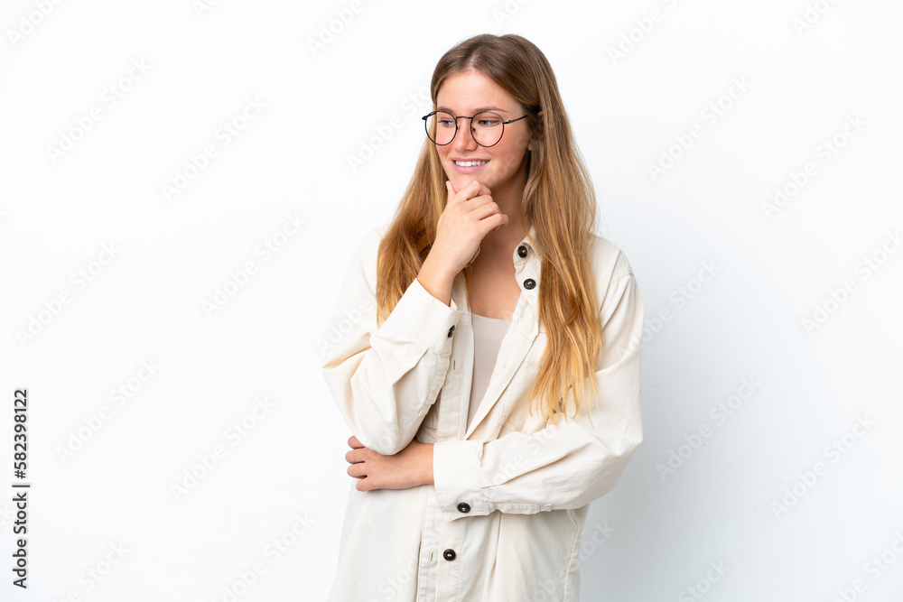 Young blonde woman isolated on white background looking to the side and smiling Young blonde woman isolated on white background looking to the side and smiling