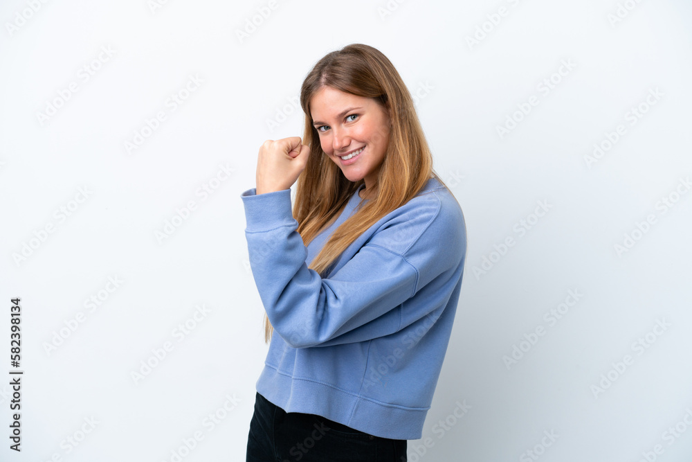 Young blonde woman isolated on white background celebrating a victory Young blonde woman isolated on white background celebrating a victory
