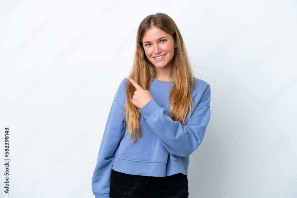 Young blonde woman isolated on white background pointing to the side to present a product Young blonde woman isolated on white background pointing to the side to present a product