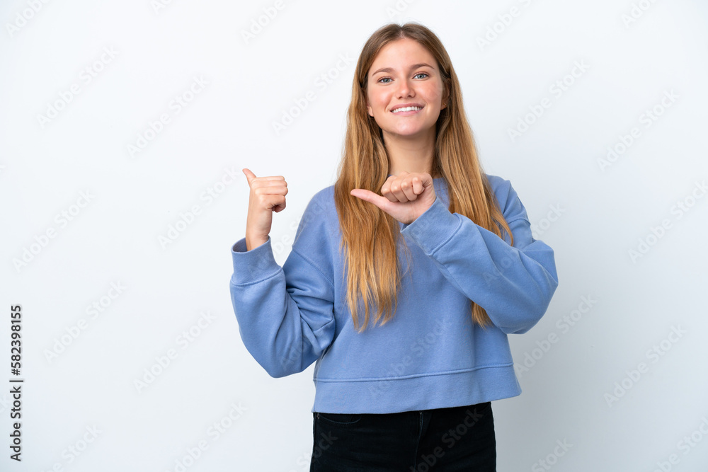 Young blonde woman isolated on white background pointing to the side to present a product Young blonde woman isolated on white background pointing to the side to present a product