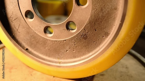Loader wheel after restoration of worn polyurethane coating. photo
