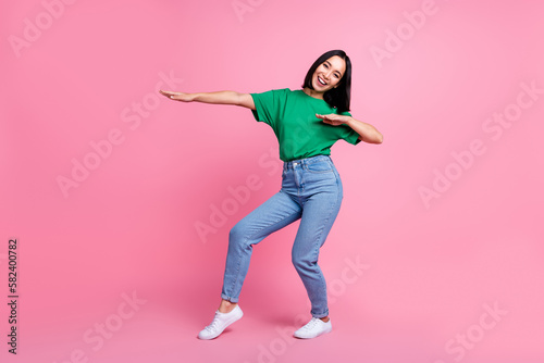 Full length photo of excited pretty person dancing make moves good mood isolated on pink color background