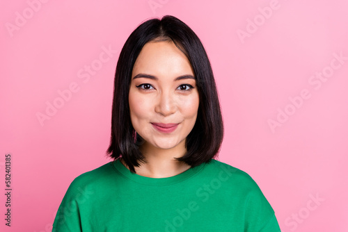 Portrait of good mood pretty woman with straight hairstyle wear oversize t-shirt smiling look at camera isolated on pink color background