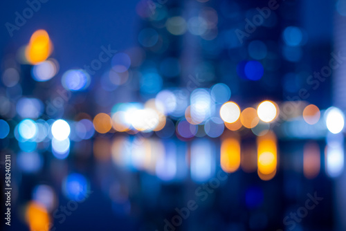 Abstract bokeh night in city background, cityscape at twilight time blurred photo