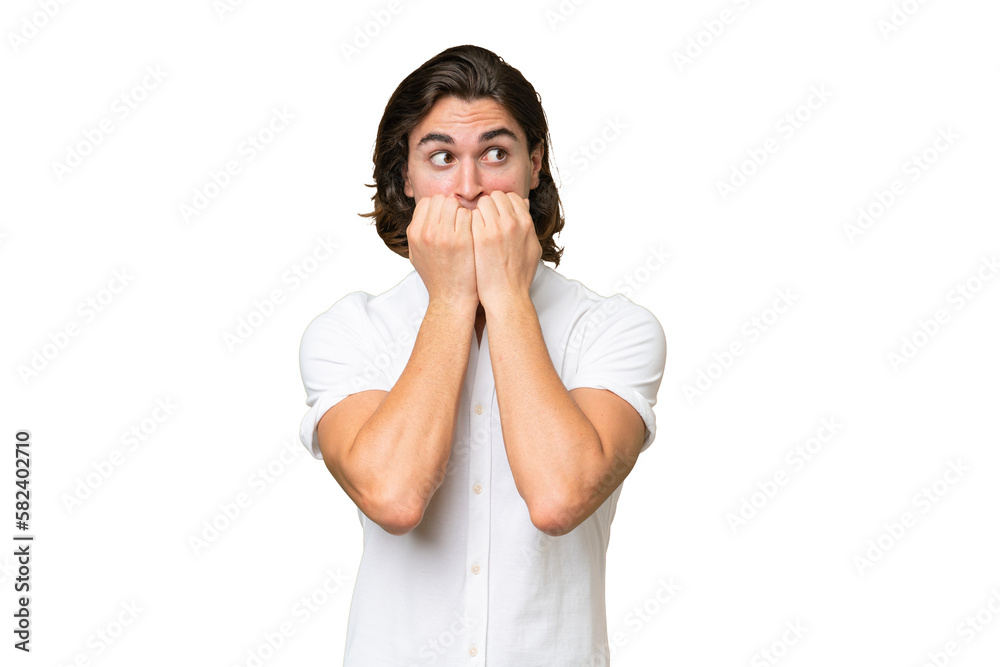 Young caucasian man isolated on green chroma background nervous and scared putting hands to mouth Young caucasian man isolated on green chroma background nervous and scared putting hands to mouth
