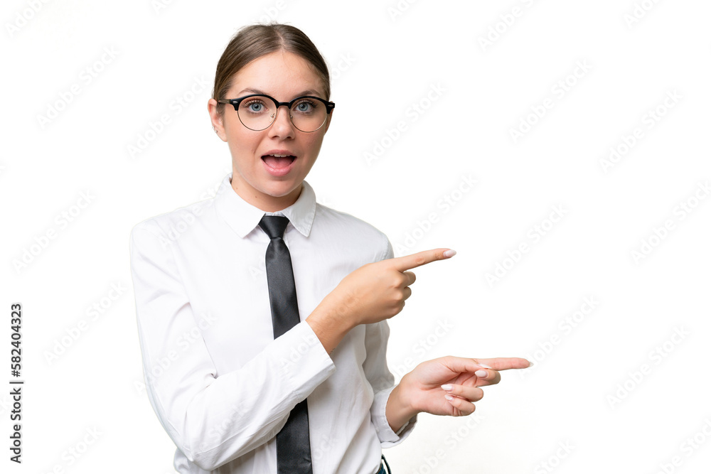 Young business caucasian woman over isolated background surprised and pointing side Young business caucasian woman over isolated background surprised and pointing side