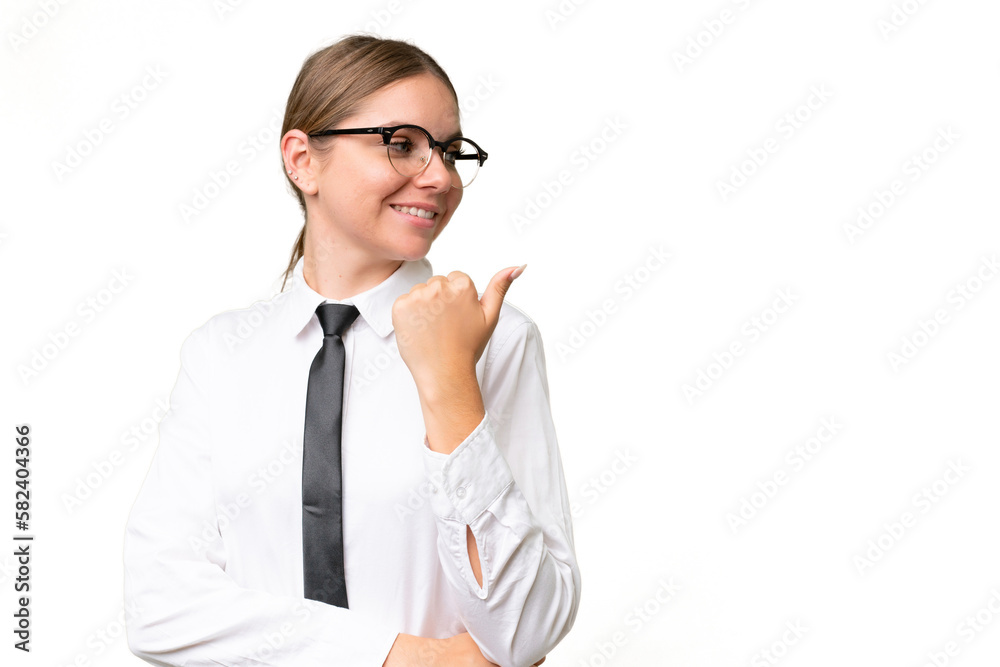 Young business caucasian woman over isolated background pointing to the side to present a product Young business caucasian woman over isolated background pointing to the side to present a product