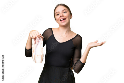 Young beautiful blonde woman practicing ballet over isolated background with shocked facial expression