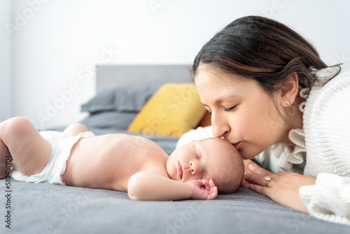 A Portrait of a beautiful mother, with her nursing baby