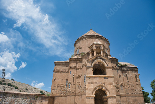 View of Cathedral of the Holy Cross, Aghtamar known in Turkish as 'Akdamar Adası Kilisesi' and blue sky in 06.13.2022, Edremit, Van,Turkey 